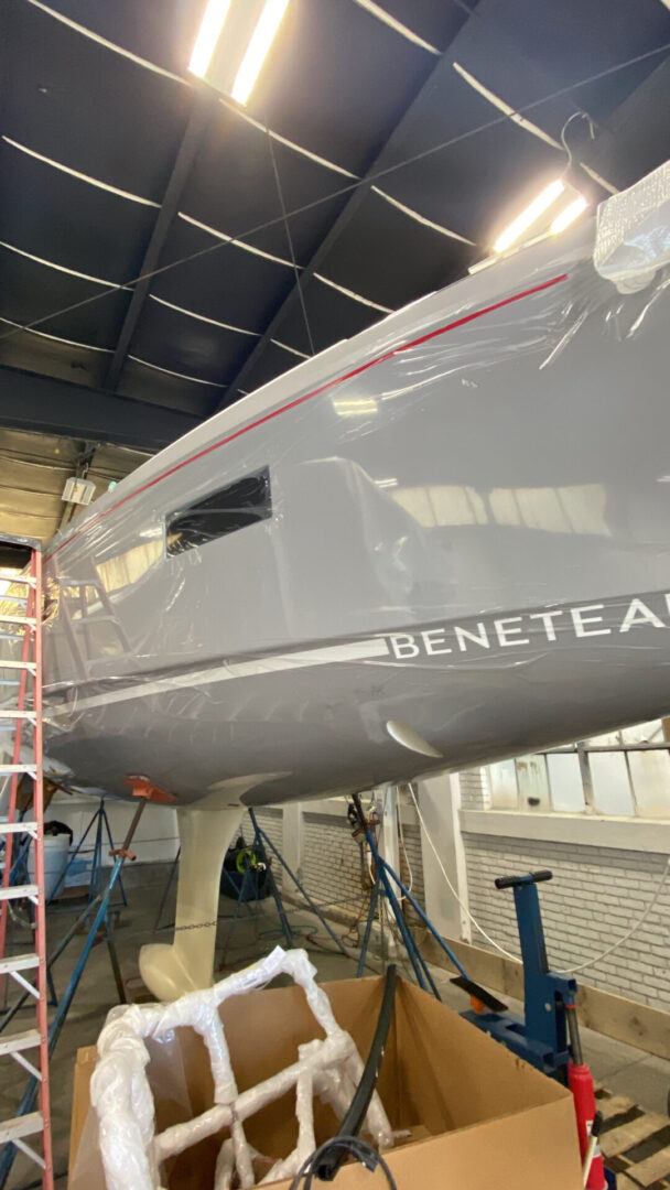 A grey plane with the name beneteau on it.